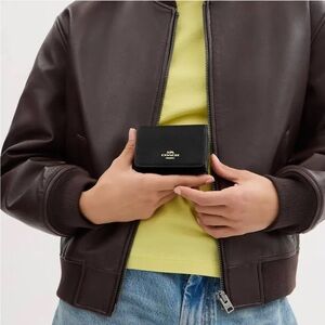 Coach women’s Signature Canvas Card Holder Wallet